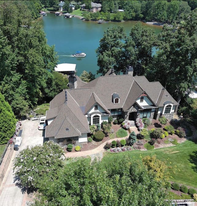 An aerial view of a lakefront home.