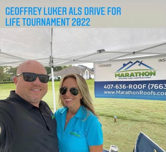 A man and woman standing under a tent with the text geffrey als drive for life tournament 2222.